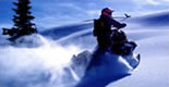 Guy riding a snowmobile